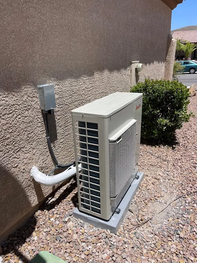 Residential air conditioning condenser unit in Harvey